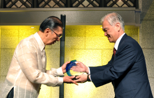 Japan Bank for International Cooperation President and CEO Hiroshi Watanabe presenting the samurai bonds token to Ambassador Domingo Siazon Jr. (left)