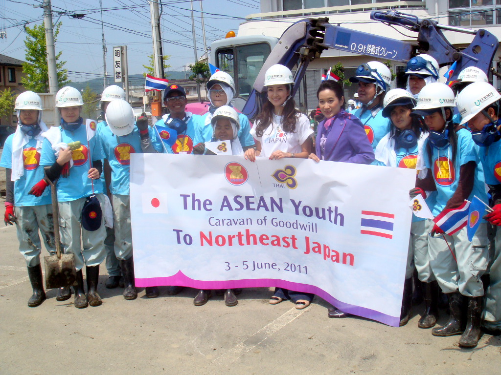 Filipino students Norel Palima and Aira Palima (left and second from left) with other participants of the ASEAN Youth Caravan of Goodwill after clearing debris caused by the March 11, 2011 earthquake. (Photo courtesy of Philippine Embassy, Tokyo.)