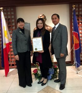 Ms. Ditta Mae C. Siena (middle) poses with Consul-General Marian R. Tirol-Ignacio (left) and Charge d’ Affaires, a.i., Eduardo M.R. Meñez of the Embassy.  The Embassy awards Ms. Siena with the Certificate of Commendation as resource speaker in a seminar-workshop held on 23 January 2017.  Photo by JP Perez.